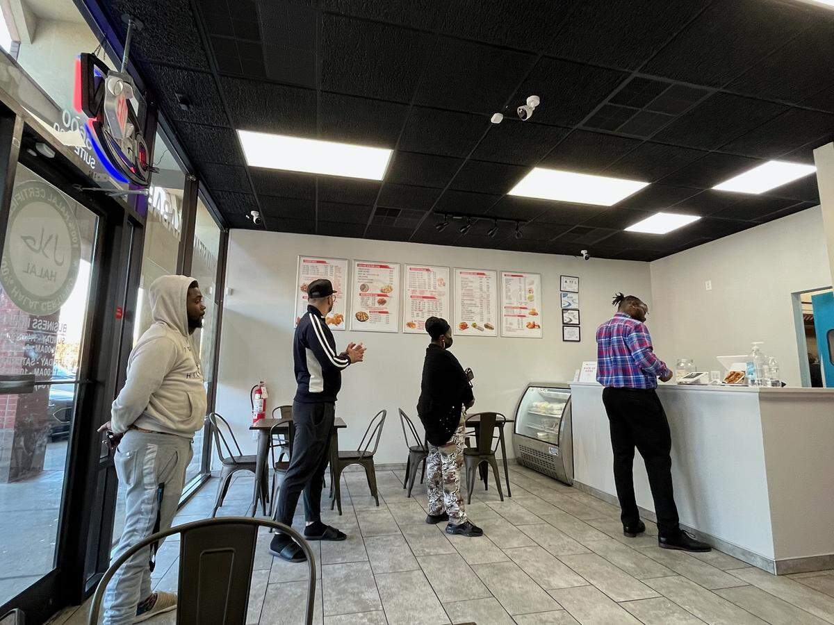 At US Fried Chicken’s Albemarle Road location, a steady stream of customers lines up after 2 p.m. for a late weekday lunch.