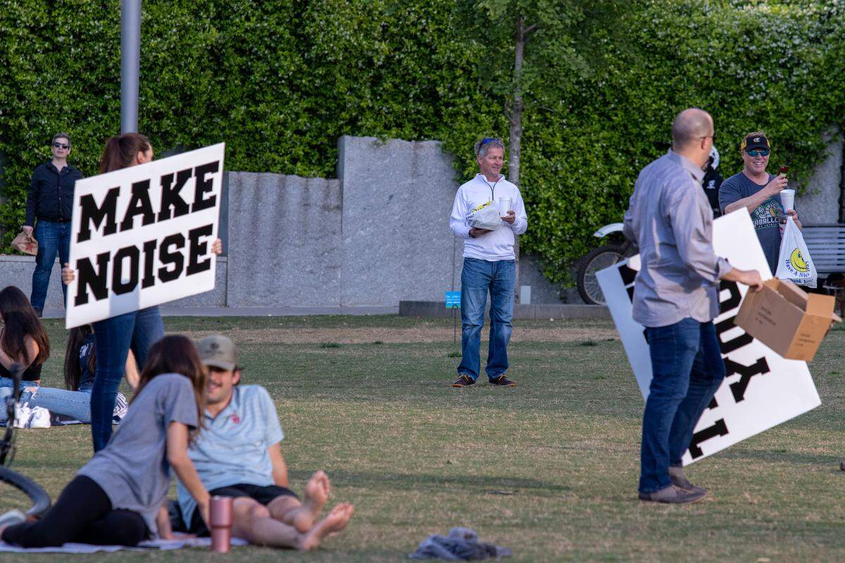 People had signs to cheer and sing along to “Sweet Caroline” as both BoA Stadium and BB&T Ballpark played the song in unison.