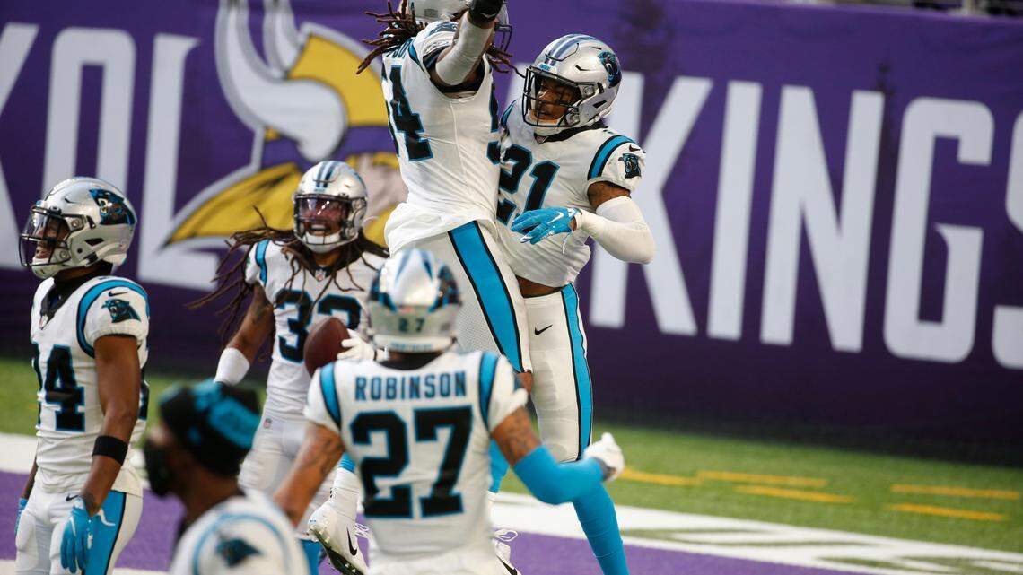 Carolina Panthers safety Jeremy Chinn (21) celebrates with teammates after returning a fumble 28-yards for a touchdown during the second half of an NFL football game against the Minnesota Vikings, Sunday, Nov. 29, 2020, in Minneapolis. (AP Photo/Bruce Kluckhohn)