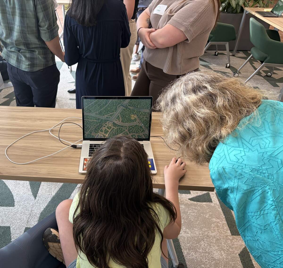 Amaya Woliansky, 10, shows off her proposed design for the I-77 South toll lane project. Sustain Charlotte, a nonprofit focused on sustainable growth, put out a call for residents to design their own changes to I-77 south, dubbed “Reimagining 77 South.”