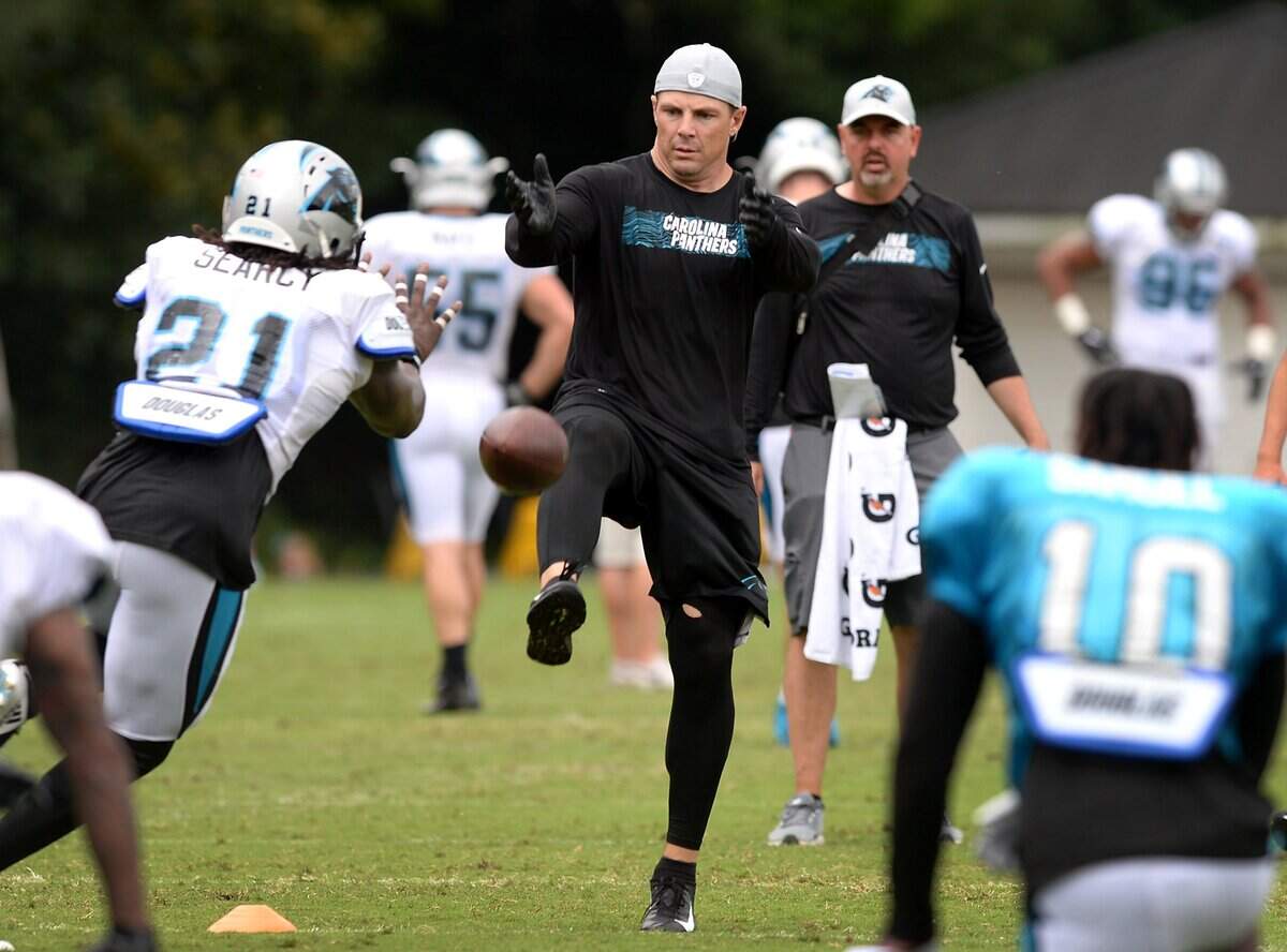 Carolina Panthers assistant special teams coach Heath Farwell, center, simulates punts for players to block during practice at Wofford College in Spartanburg, SC during training camp 2018.