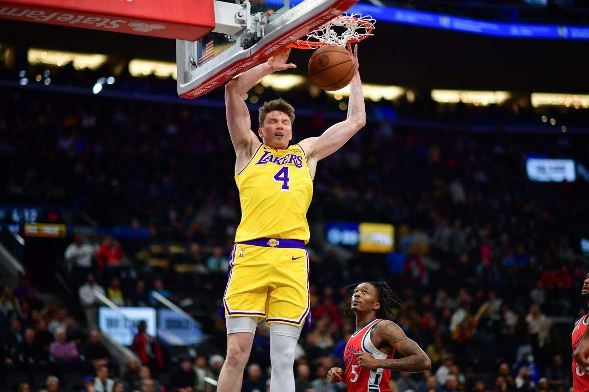 Dalton Knecht (4) dunks for the basket against the Los Angeles Clippers during the second half at Intuit Dome.