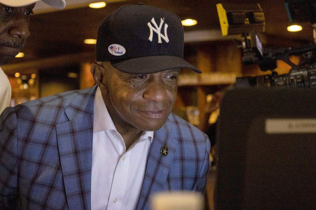 Incumbent Mecklenburg Sheriff Garry McFadden smiles as he takes a look at voting totals during the Black Political Caucus’ watch party at Studio 29 on Tuesday, May 17, 2022 in Charlotte.