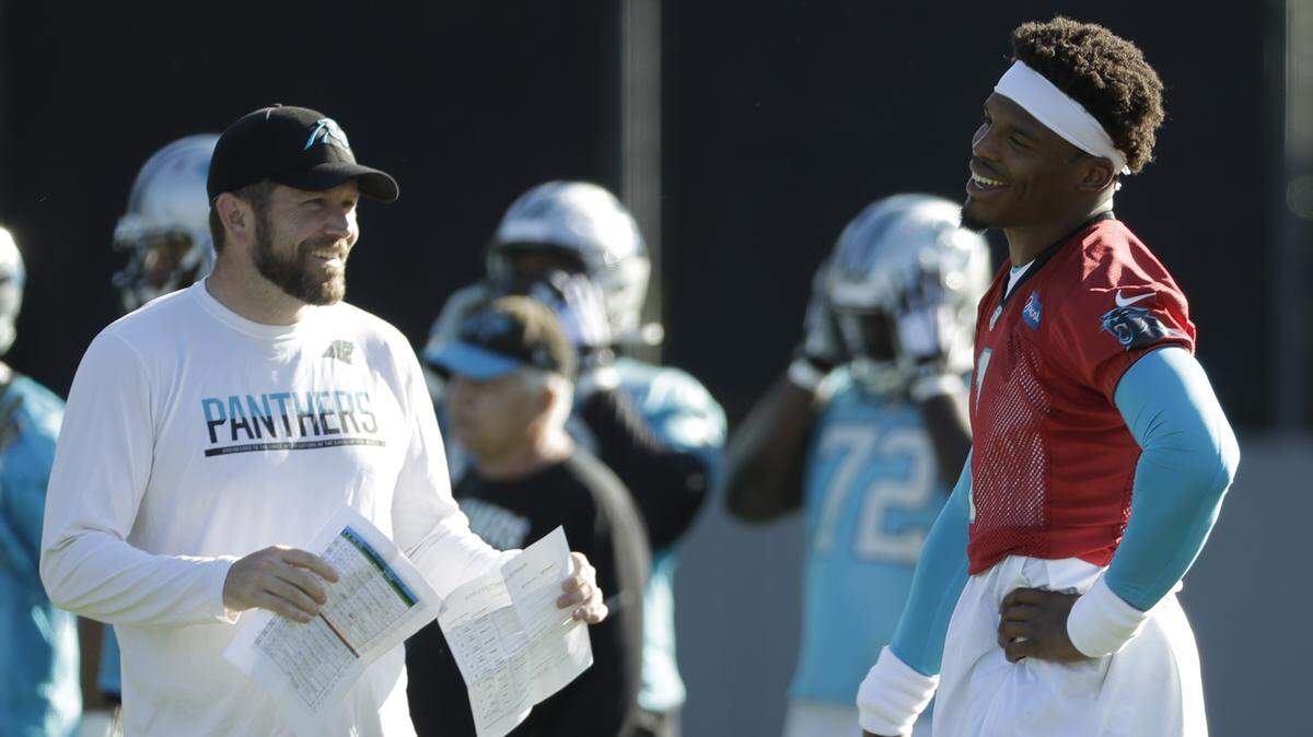 Carolina Panthers quarterback Cam Newton, right, will spend a lot of time this season with QB coach Scott Turner, the son of Panthers offensive coordinator Norv Turner.