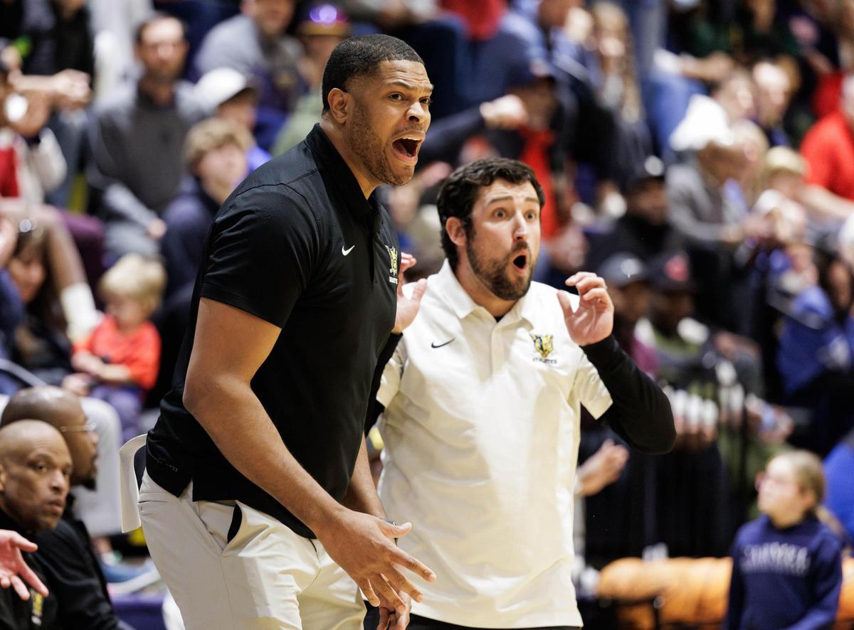 Carmel Christian head coach Tamar Slay (center) reacts to a called foul during late 2nd quarter action. Carmel Christian would host Providence Day in the NCISAA state semifinal Tuesday February 18, 2025.