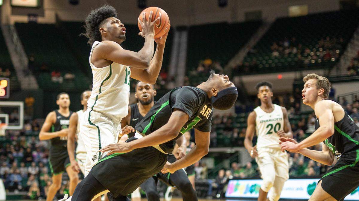 Guard Malik Martin (left) averaged more than nine points a game as a freshman for the Charlotte 49ers last season.