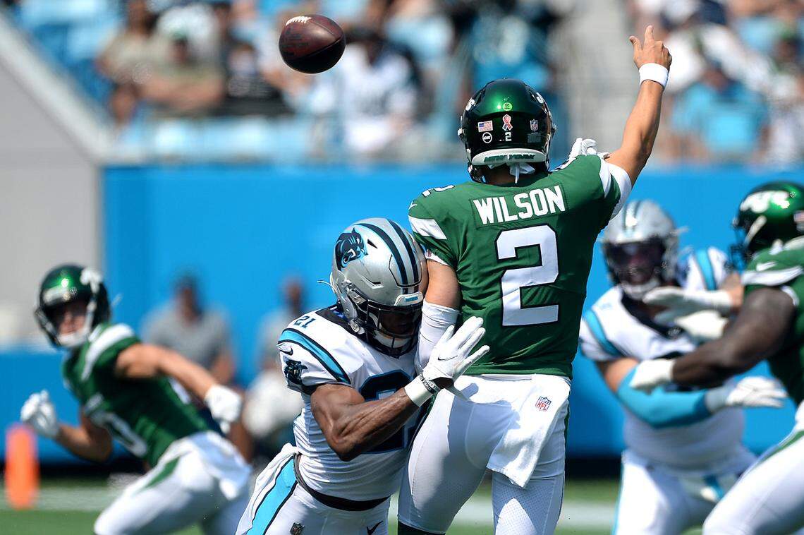 Carolina Panthers safety Jeremy China, left, hits New York Jets quarterback Zach Wilson, right, during second quarter action at Bank of America Stadium in Charlotte, NC on Sunday, September 12, 2021. The Panthers defeated the Jets 19-14.