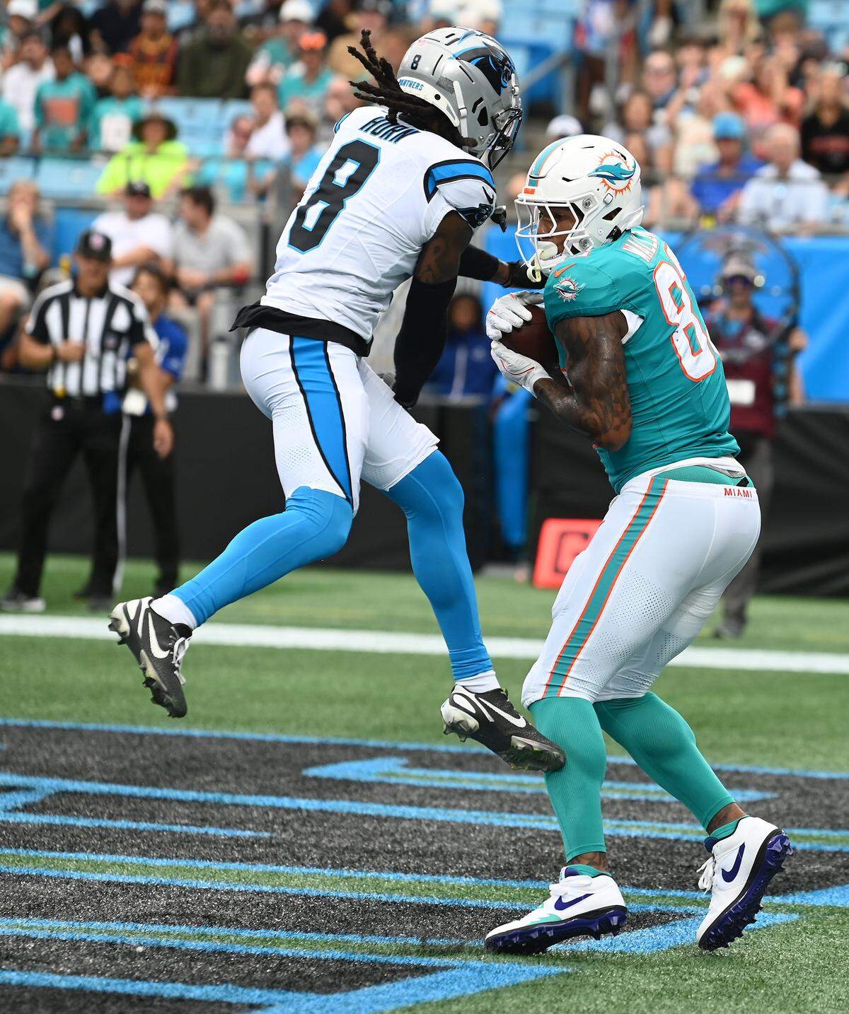 Miami Dolphins tight end Darren Waller, right, catches a pass in the end zone for a touchdown as Carolina Panthers cornerback Jaycee Horn, left, applies pressure during action on Sunday, October 5, 2025 at Bank of America Stadium in Charlotte, NC.