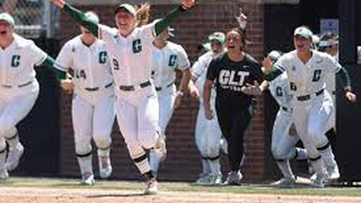 Sam Gress (9) and the rest of her Charlotte 49ers teammates charge from the dugout after the 49ers toppled Wichita State to win the AAC Tournament title in Kansas on May 11, 2024.
