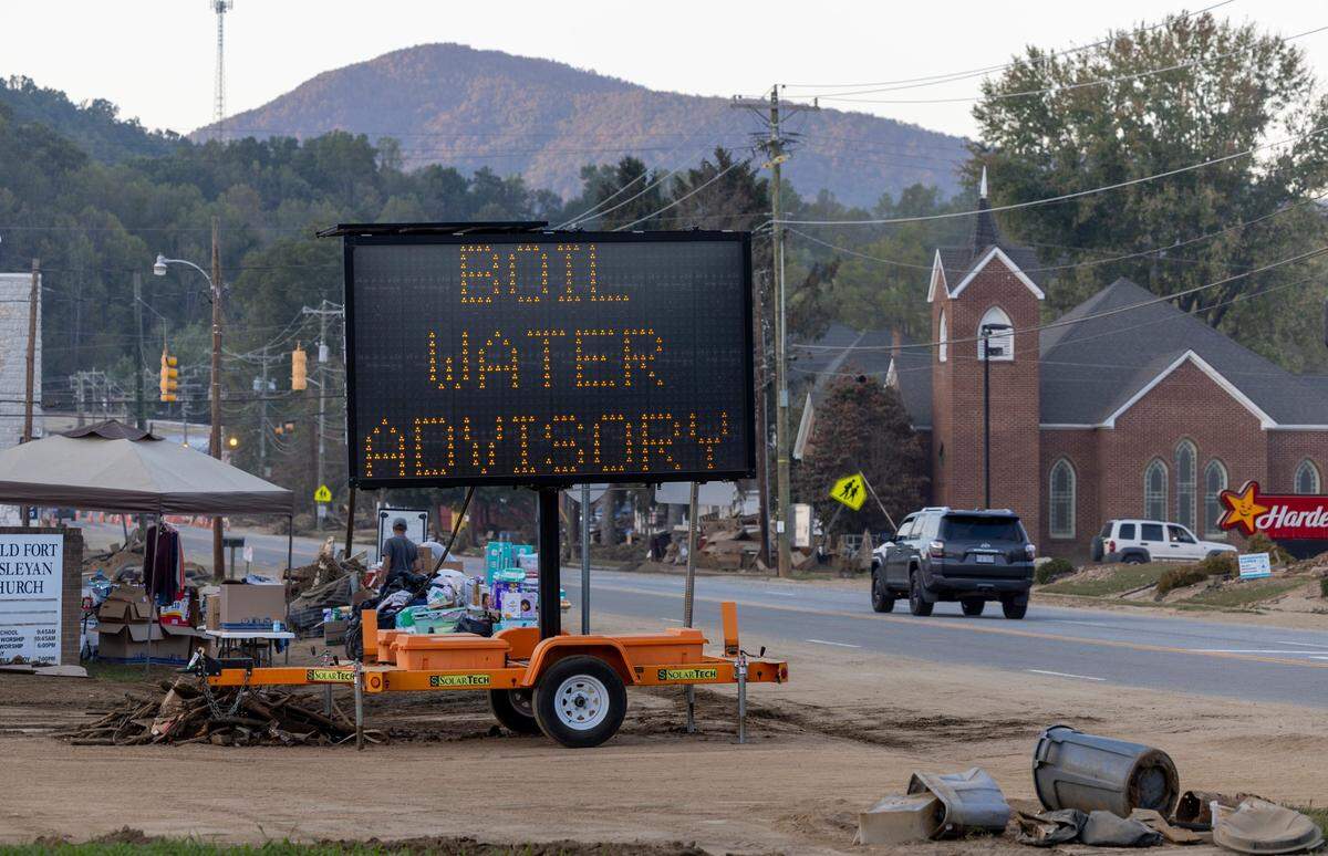 A ‘Boil Water Advisory’ notification in downtown Old Fort, N.C., on Tuesday, October 8, 2024. Old Fort put their water system back on line ten days after Hurricane Helene flooded the treatment plant shutting it down.