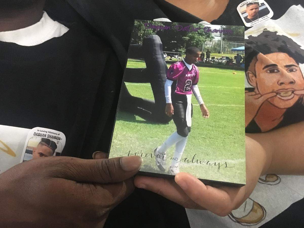 A plaque shows DaQuan Shannon in his football uniform. The Queen City Tarheels will honor DaQuan next season by putting his number 2 on their jerseys.