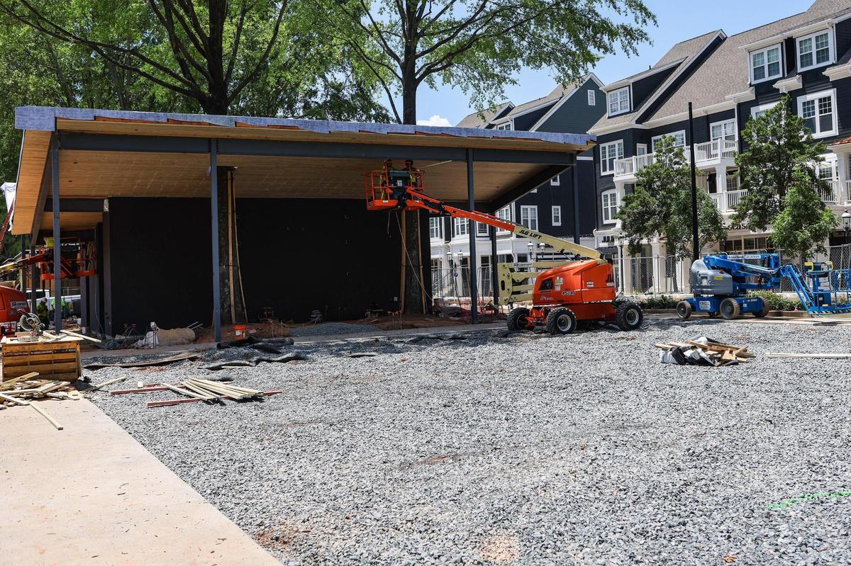 A covered stage in The Plaza at Birkdale Villagein Huntersville is being built around two live trees. The stage will include a 10-by-18-foot LED screen to show movies and sporting events.