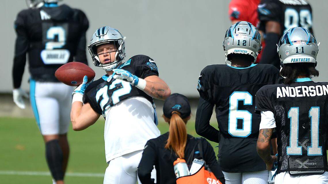 Carolina Panthers running back Christian McCaffrey tosses a ball back to an assistant during practice on Wednesday, October 6, 2021. WednesdayÕs practice was McCaffreyÕs first on-field practice since he strained a hamstring during action against the Houston Texans.