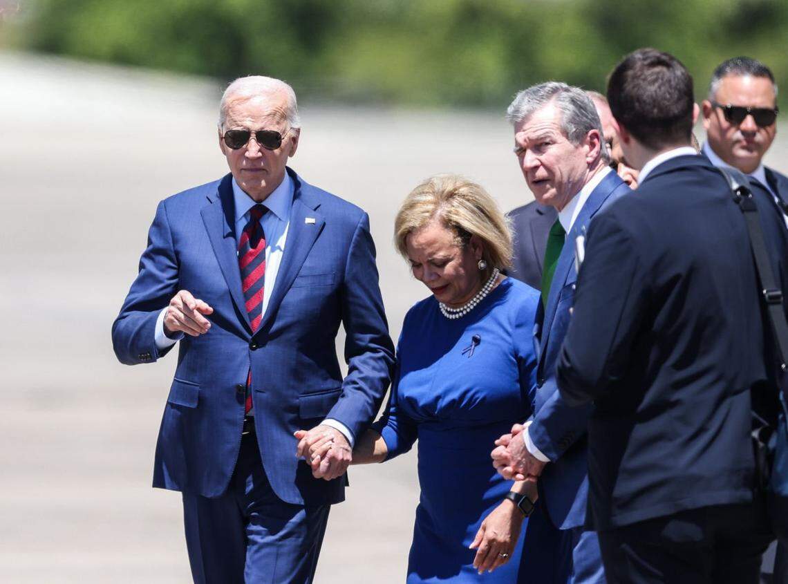 Vi Lyles joins President Joe Biden upon his arrival at North Carolina Air National Guard in Charlotte on May 2, 2024, when he met with families of the four slain Charlotte officers.