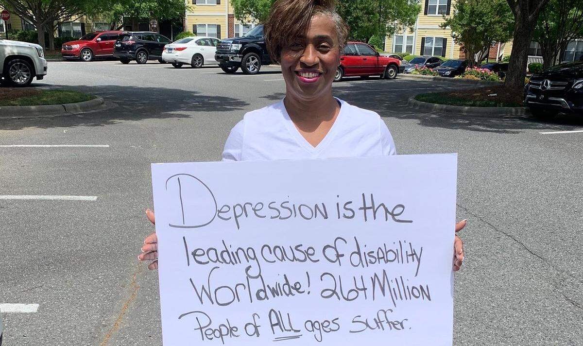 Look for Fonda Bryant in uptown Charlotte throughout May, bringing awareness to mental health.