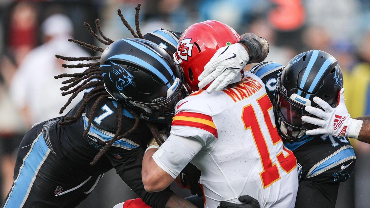 Panthers outside linebacker Jadeveon Clowney, left, and defensive lineman DeShawn Williams, sack Chiefs quarterback Patrick Mahomes at Bank of America Stadium in Charlotte, NC on Sunday, Nov. 24, 2024.