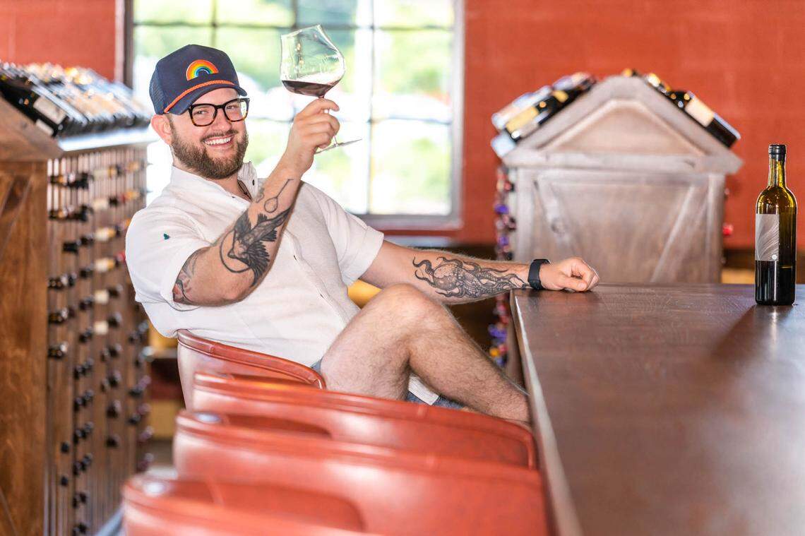 Chef and owner Sam Hart of Counter- raises a glass.