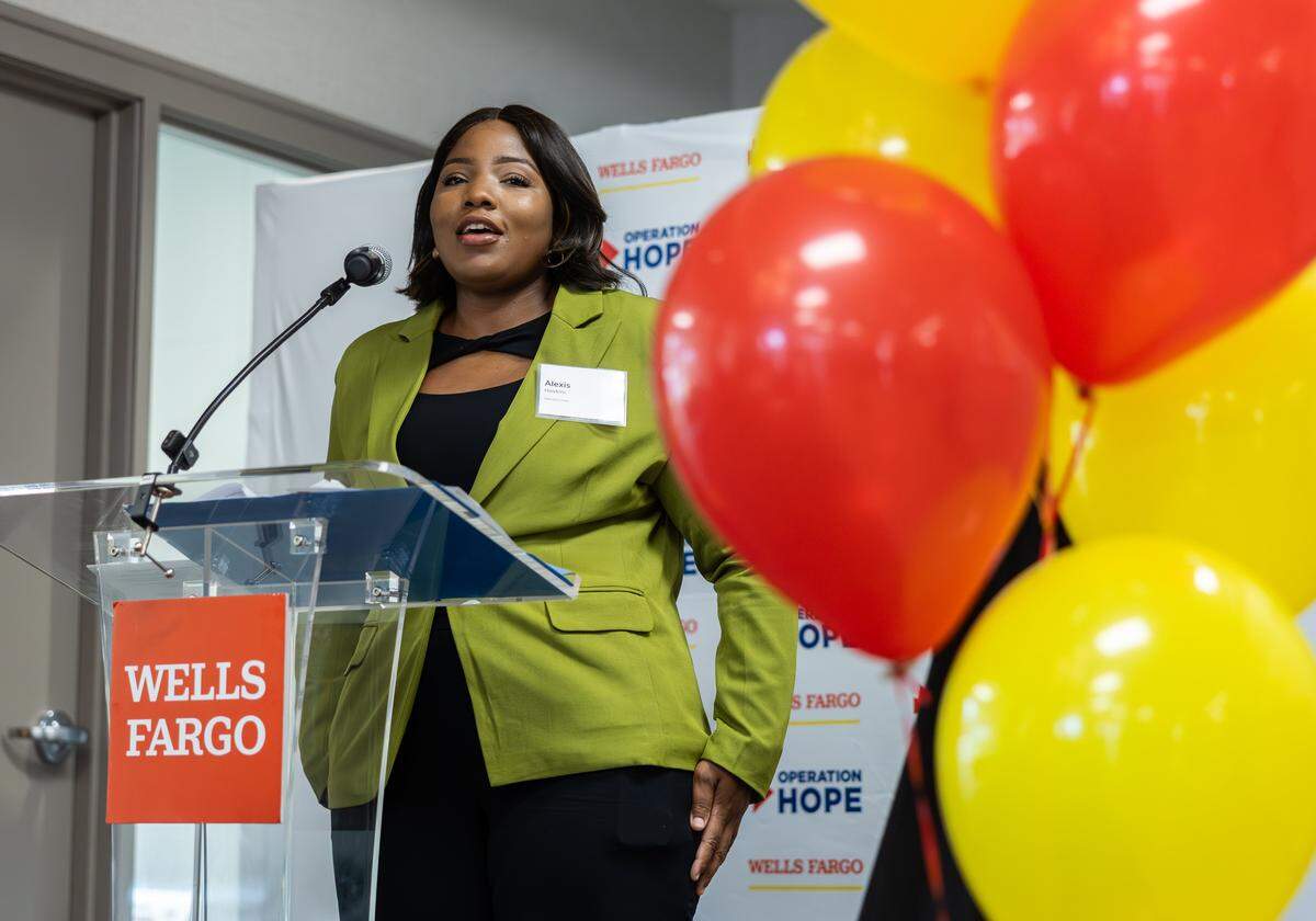 Alexis Hawkins speaks about how she benefited from the Operation HOPE program during a press conference for Wells Fargo and Operation HOPE at the redesigned Freedom Drive bank branch in Charlotte, N.C., on Thursday, September 25, 2025.