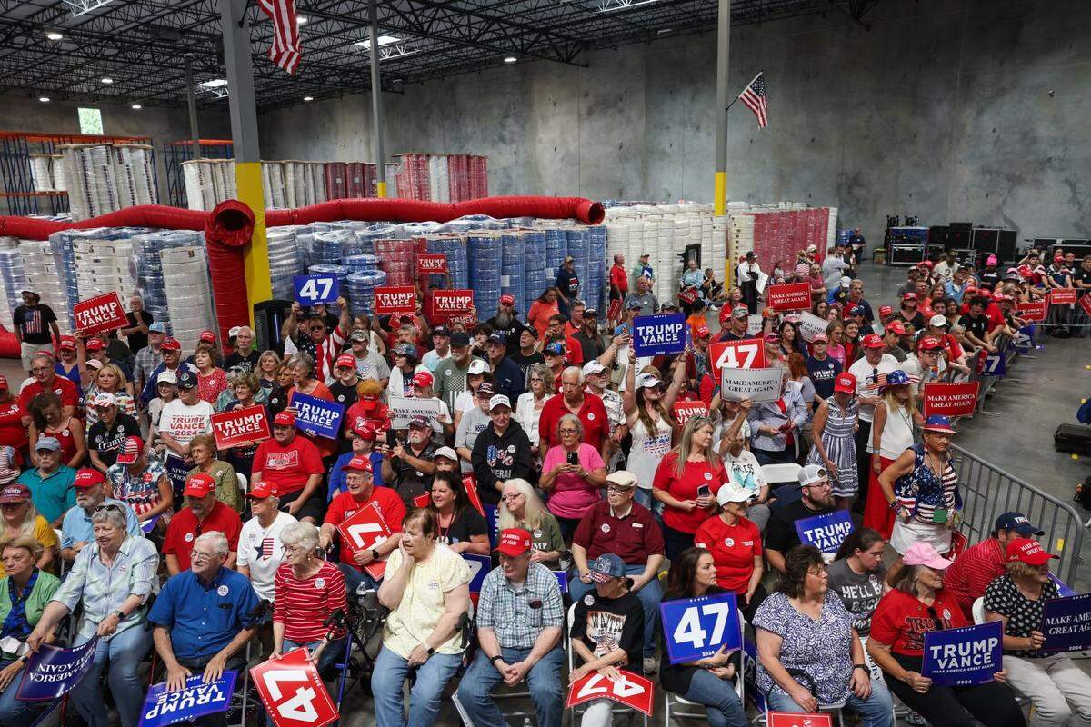 Supporters cheer on as former President Donald Trump speaks at a campaign rally inside the Mosack Group manufacturing warehouse in Mint Hill, NC on Wednesday, September 25, 2024.