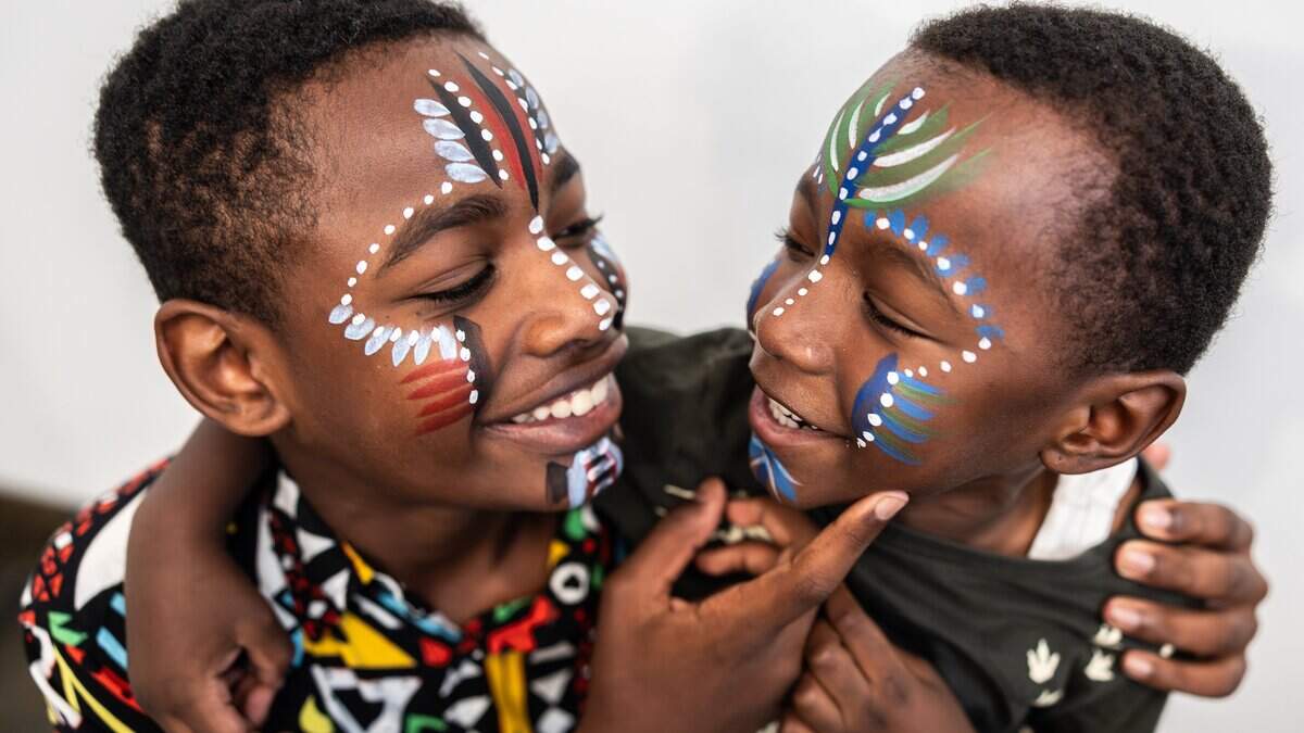 Mason Gabriels, 12, left, and his brother, Matthew, 5, admire each other’s faceprint during Juneteenth at The Gantt at Harvey B. Gantt Center for African-American Arts + Culture in Charlotte, N.C., on Friday, June 19, 2026. 