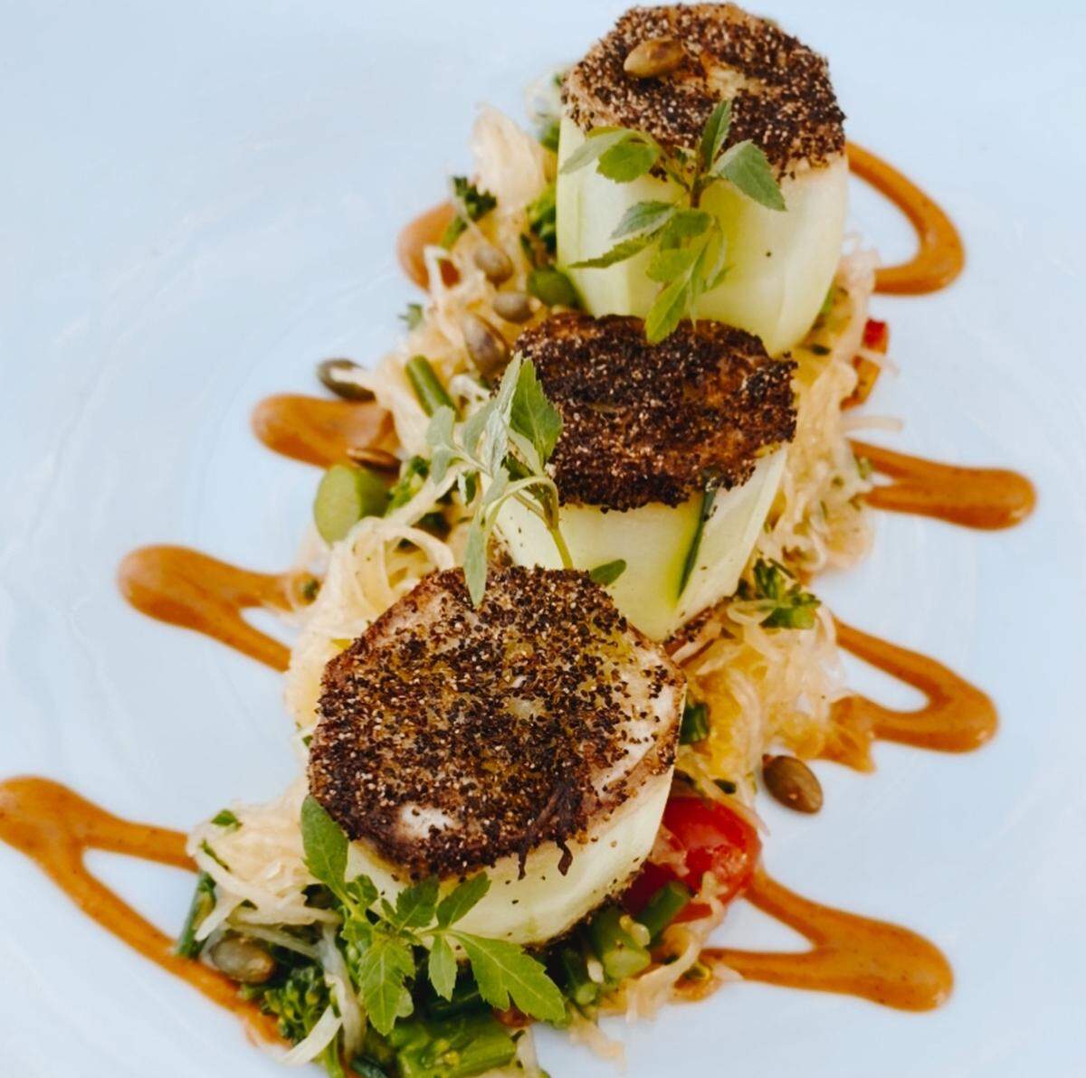 Check out the cucumber scallops and other plant-based dishes at Alchemy Restaurant & Bar. 
