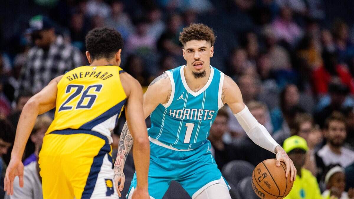 Charlotte Hornets guard LaMelo Ball (1) dribbles against Indiana Pacers guard Ben Sheppard (26) during the first quarter at Spectrum Center.