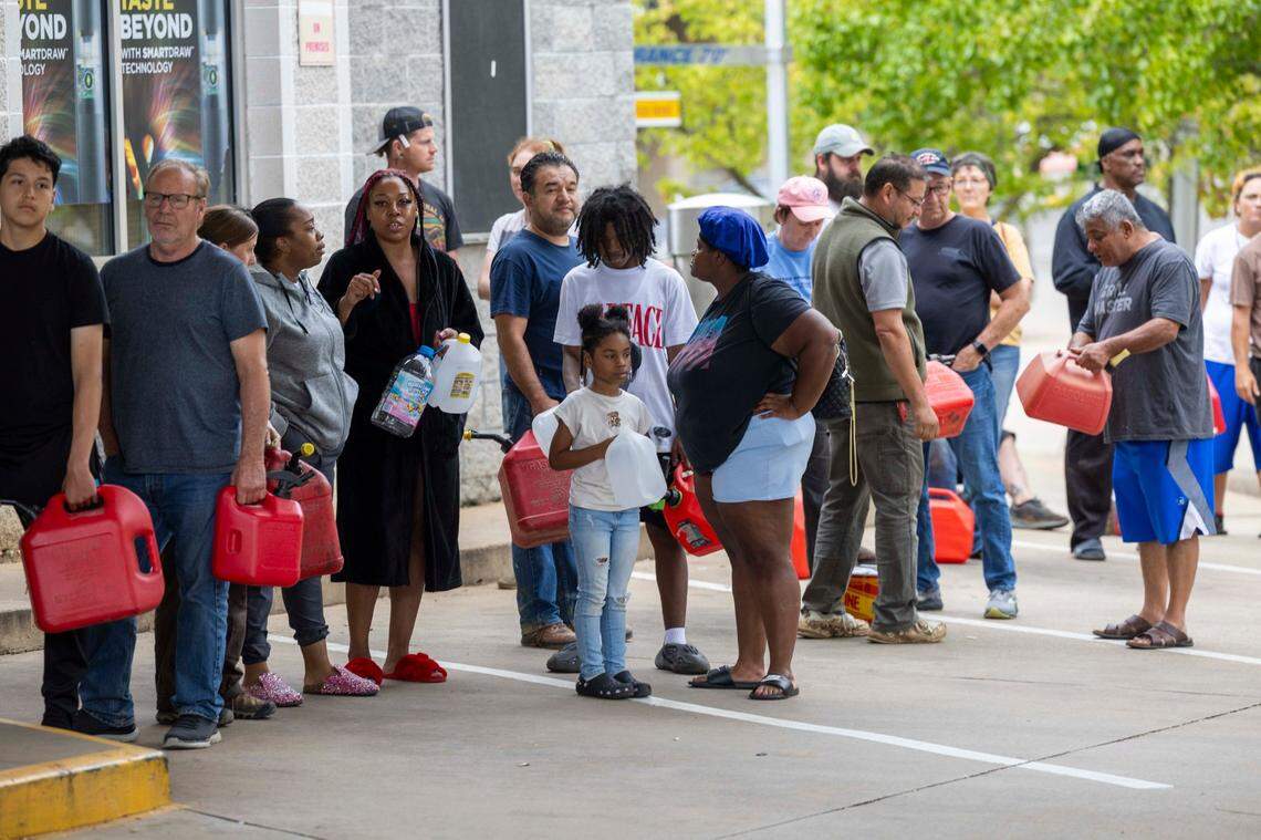 Asheville residents residents line up for gasoline at a gas station on Sunday, Sept. 29, 2024. The remnants of Hurricane Helene caused widespread flooding, downed trees, and power outages in western North Carolina.