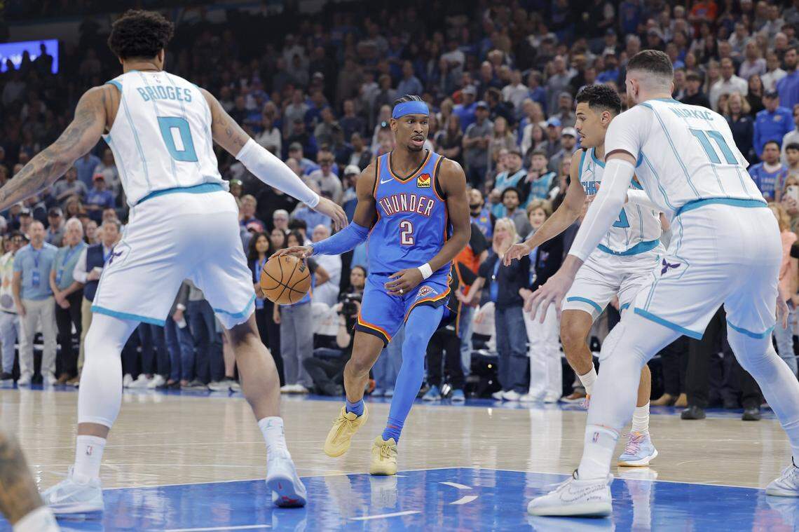 Oklahoma City Thunder guard Shai Gilgeous-Alexander (2) dribbles down the court against the Charlotte Hornets during the first quarter at Paycom Center.