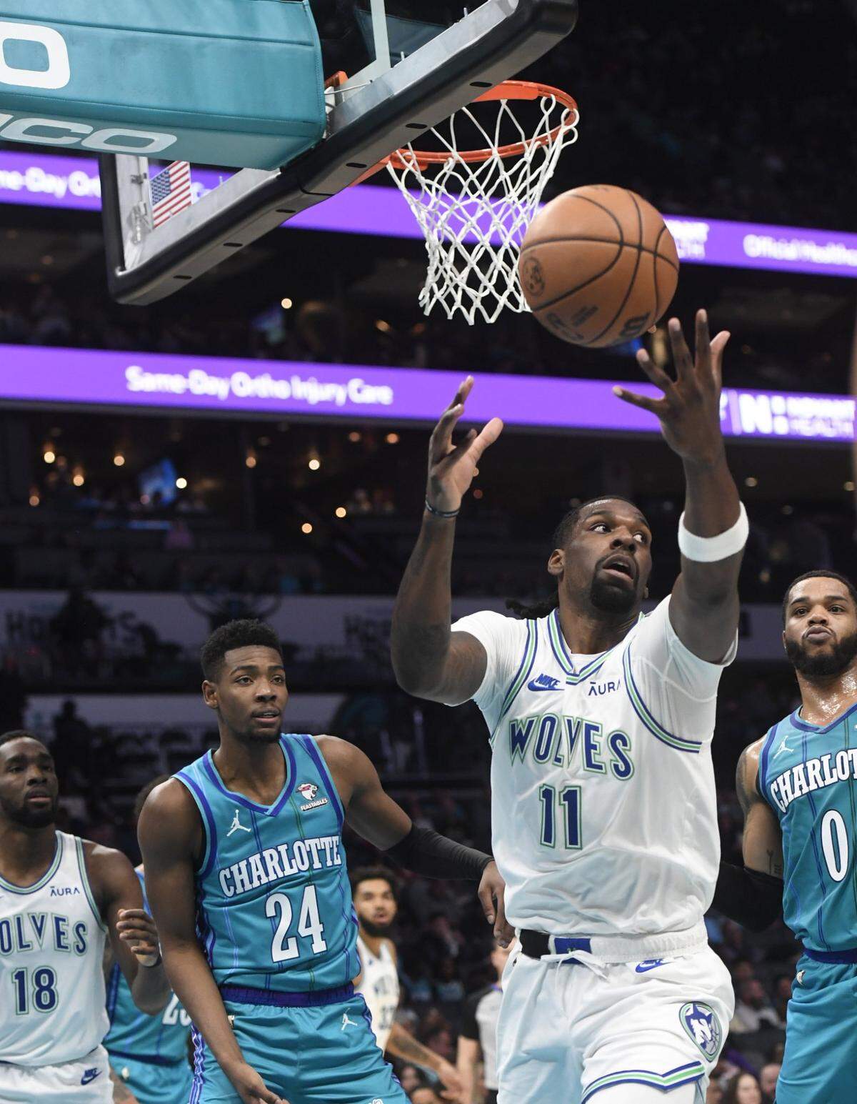 Dec 2, 2023; Charlotte, North Carolina, USA;  Minnesota Timberwolves center Naz Reid (11) grabs a rebound during the first half against the Charlotte Hornets at the Spectrum Center. Mandatory Credit: Sam Sharpe-USA TODAY Sports