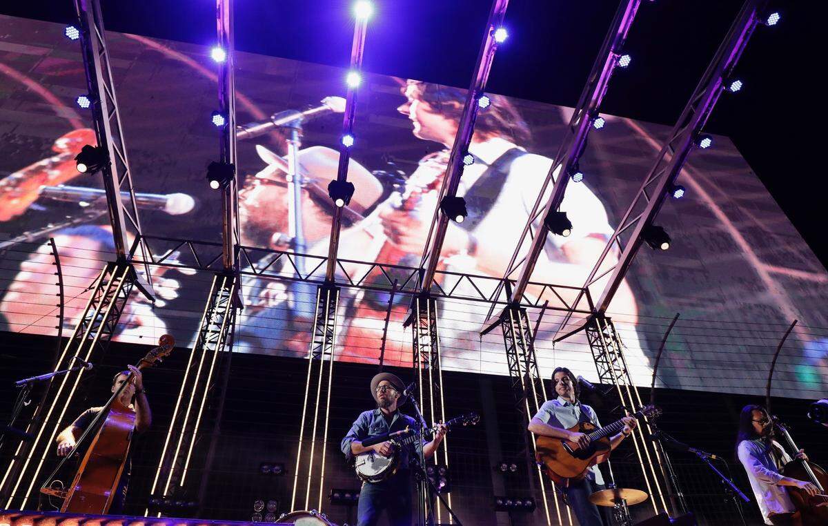 The Avett Brothers perform at Charlotte Motor Speedway in a drive-in-style setting on Saturday night.