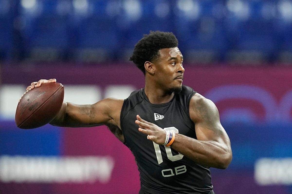 Liberty quarterback Malik Willis runs a drill during the NFL football scouting combine in Indianapolis.