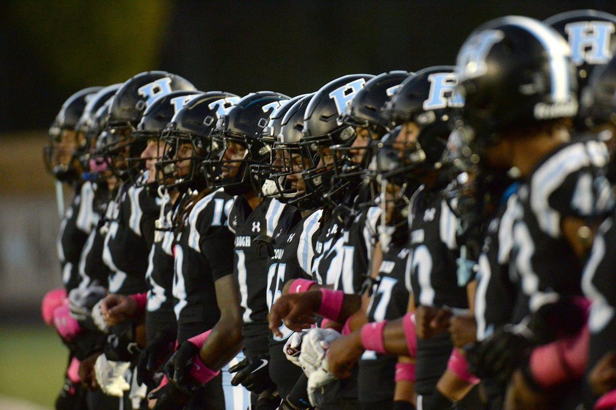 Hough High seniors link arms before the game Friday. Sweet 16 #5, Mallard Creek trailed #3, Hough19-0 at halftime in a high stakes football game on Friday, Oct. 18, 2024.