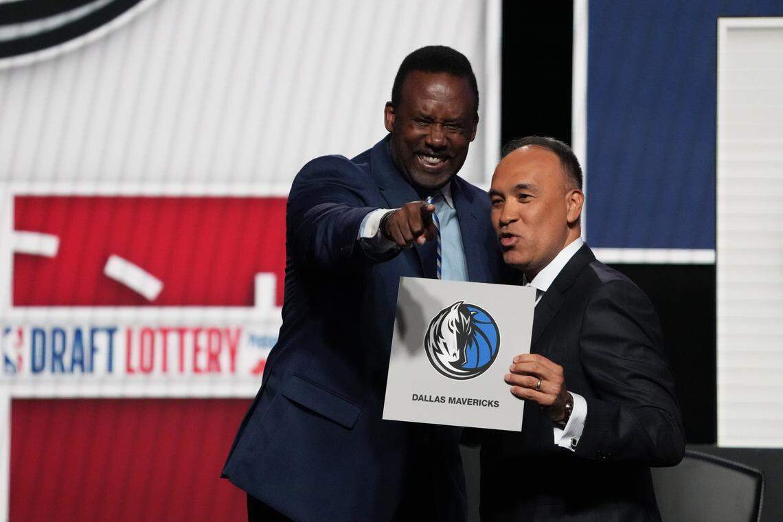 Rolando Blackman of the Dallas Mavericks reacts with Mark Tatum NBA Deputy Commissioner after winning the the first pick during the 2025 NBA Draft Lottery at McCormick Place.
