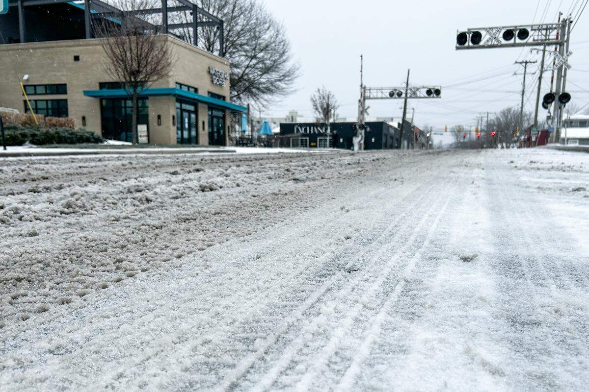 36th Street in Charlotte’s NoDa neighborhood is covered in a mix of frozen rain and sleet that fell overnight in Charlotte early Sunday morning on January 25, 2026.