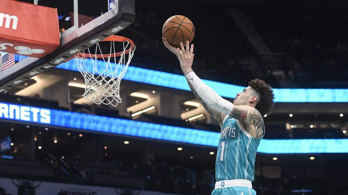Charlotte Hornets guard LaMelo Ball (1) drives in during the second half against the Philadelphia 76ers at the Spectrum Center.