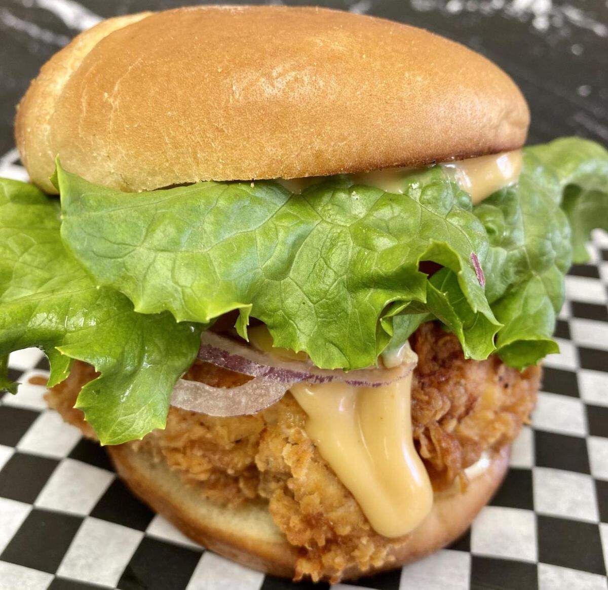 Derita Dairy Bar’s Chicken Sandwich can be tossed in your choice of sauces.