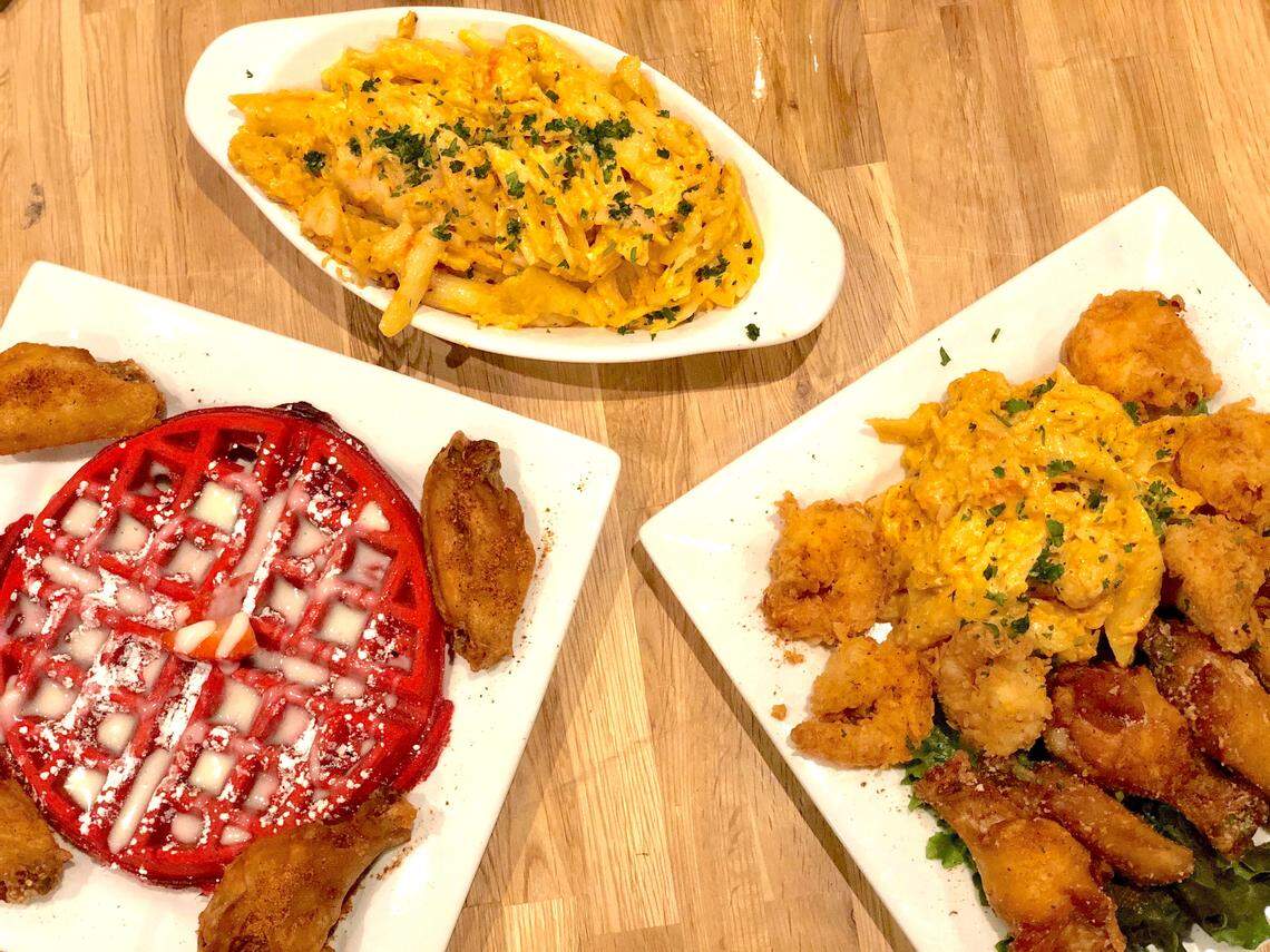 An Aunt Bungie Chicken & Red Waffle combo, a half lobster mac and a combo with fried shrimp, Parmesan wings and lobster mac at Cuzzo’s Cuisine.