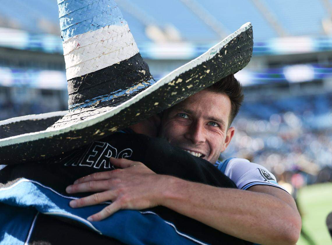 Charlotte FC midfielder Brandt Bronico, right, hugs a fan after a win against the Atlanta United at the Bank of America Stadium in Charlotte, N.C., on Sunday, April 10, 2022.