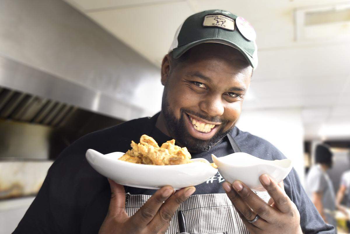 Greg Collier’s mad genius: He simmers chicken skins, chills them, then fries them and serves them with buttermilk chive dip.