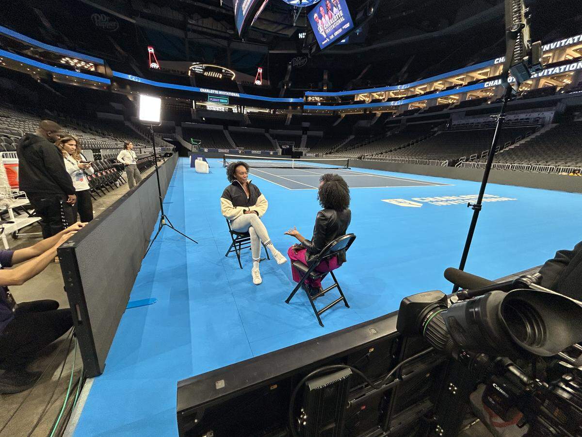 WSOC’s DaShawn Brown (back to camera) interviews tennis star Venus Williams in Charlotte in December 2025, prior to Williams playing in the Charlotte Invitational.