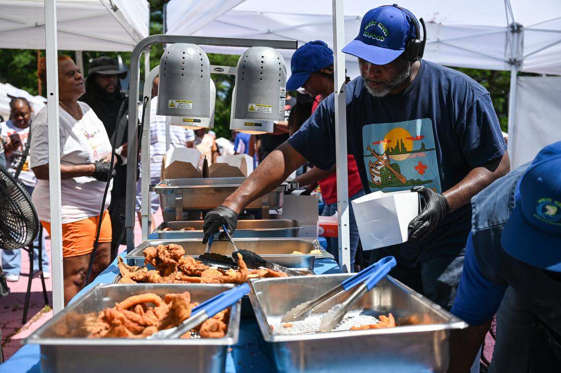 West End Fresh Seafood serves customers fried whiting, flounder, sawi and shrimp, along with seasoned french fries, during the West Side Fish Fry at West Complex in Charlotte on Saturday, April 18, 2026.