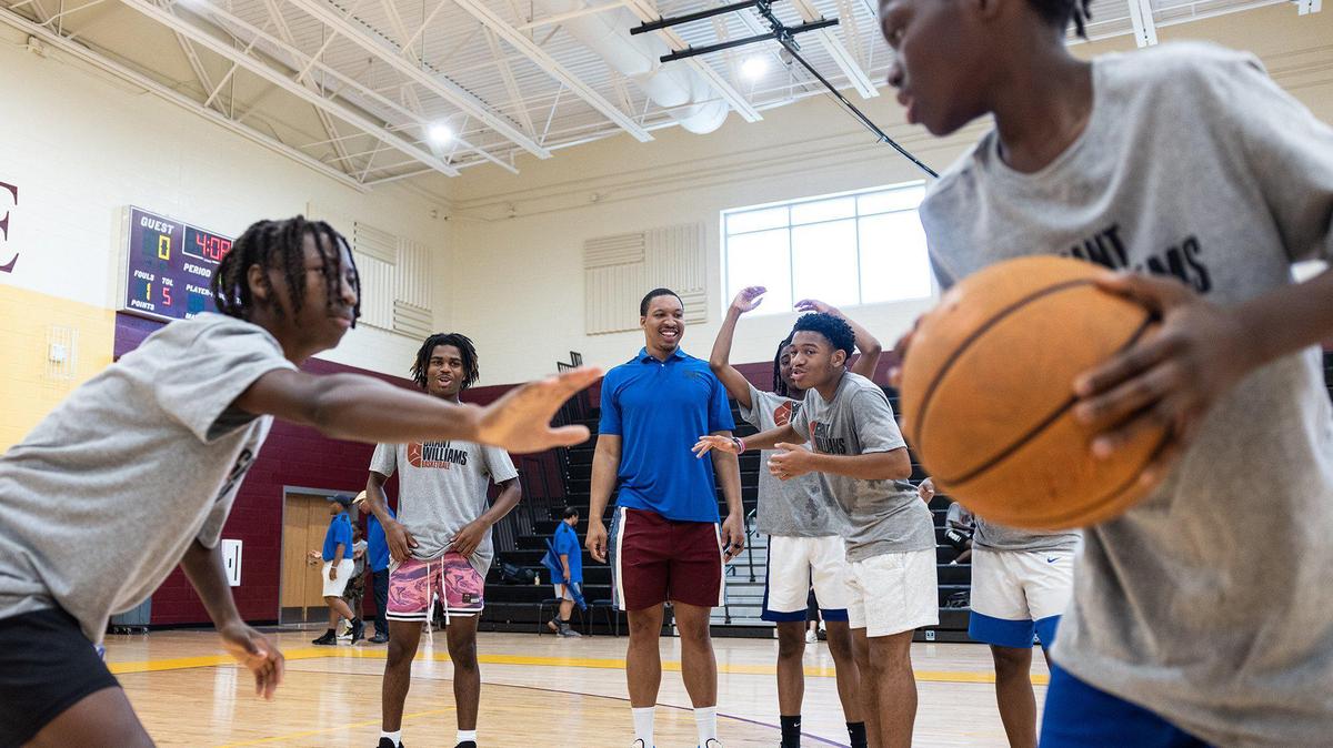 Dallas Mavericks Grant Williams and former Providence Day basketball player watches kids play one on one at his basketball camp at West Charlotte High School in Charlotte, N.C., on Friday, July 21, 2023.