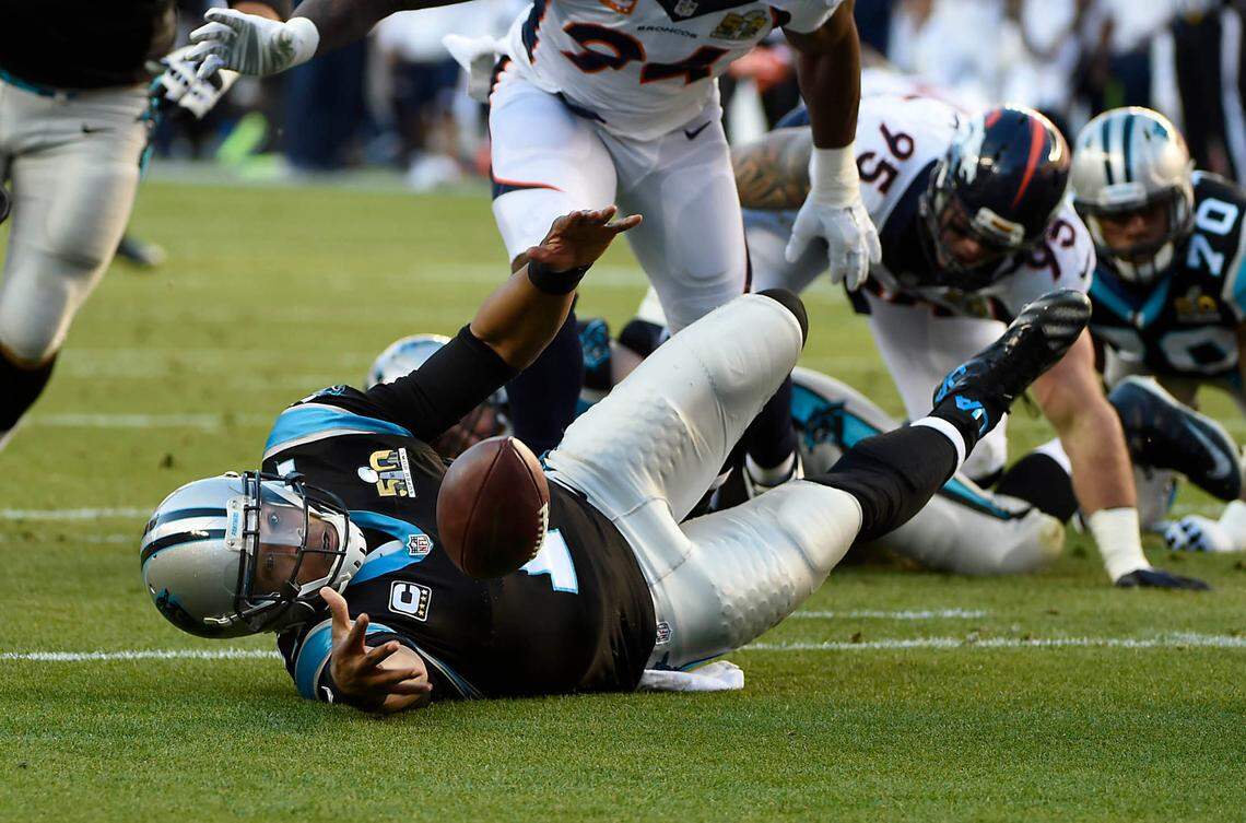 The ball gets away from Cam Newton after Von Miller strip-sacked him in the first quarter of the Super Bowl.