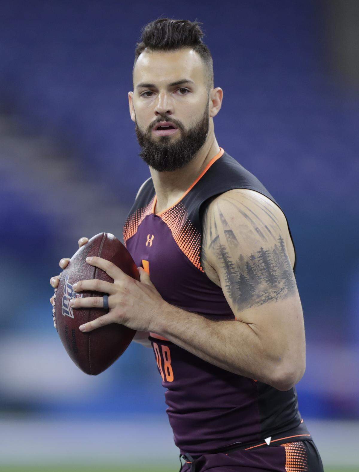 West Virginia quarterback Will Grier runs a drill at the NFL football scouting combine in Indianapolis, Saturday, March 2, 2019. (AP Photo/Michael Conroy)