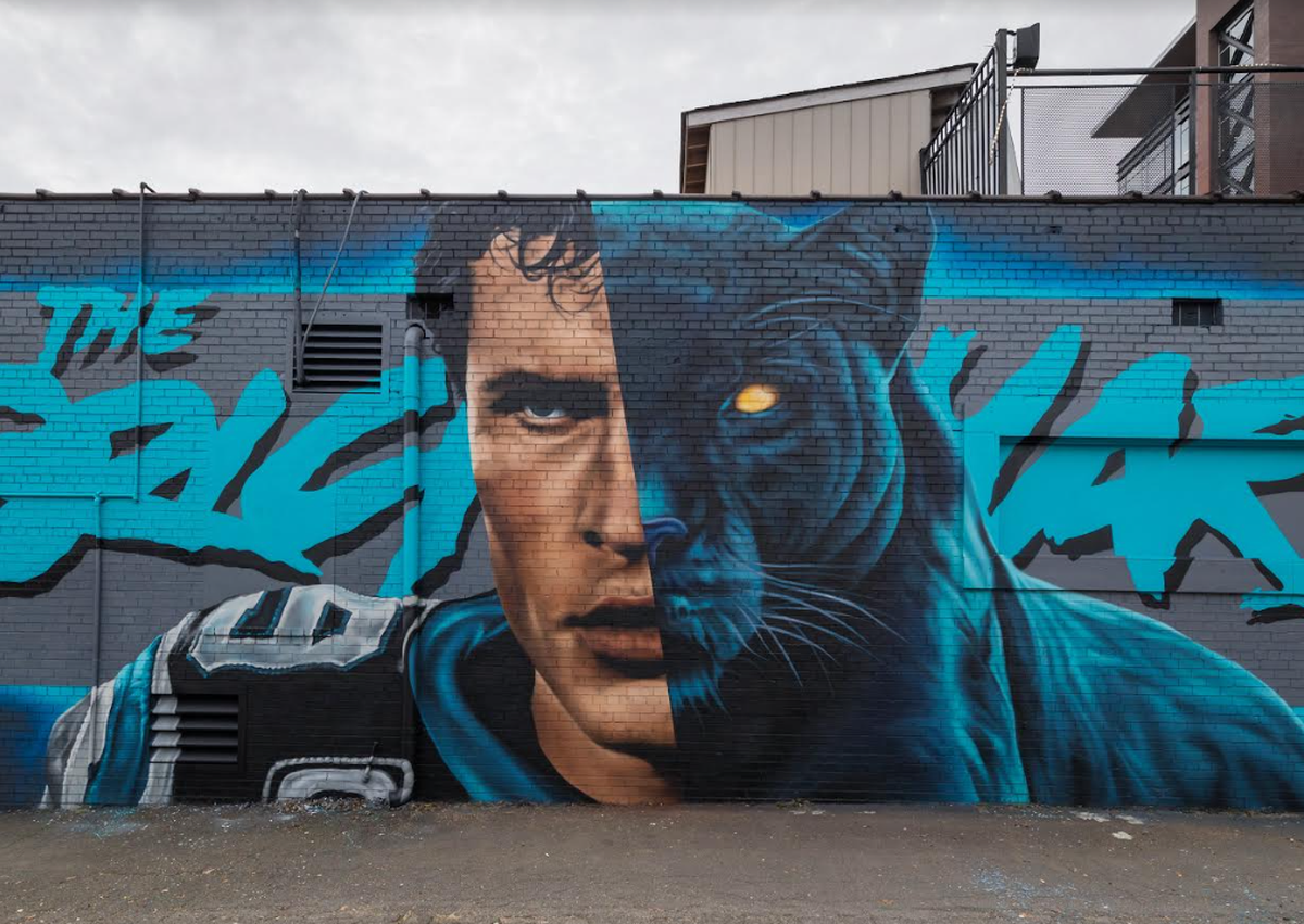 A mural of former Carolina Panthers player Luke Kuechly at The Brickyard in South End, painted by Matt Moore.