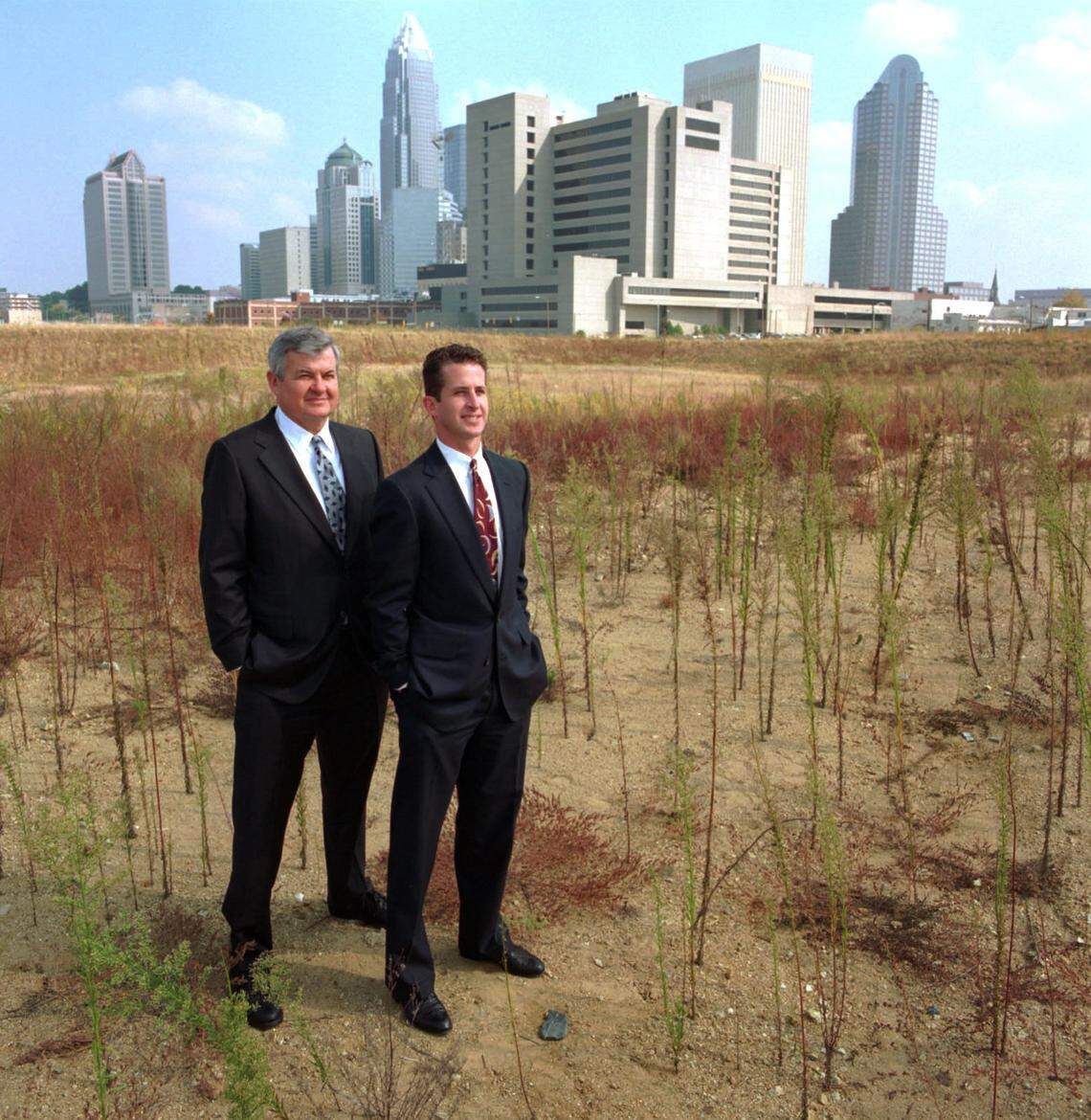 Jerry Richardson (left) and son Mark Richardson pose on the future site of Bank of America Stadium in 1993.