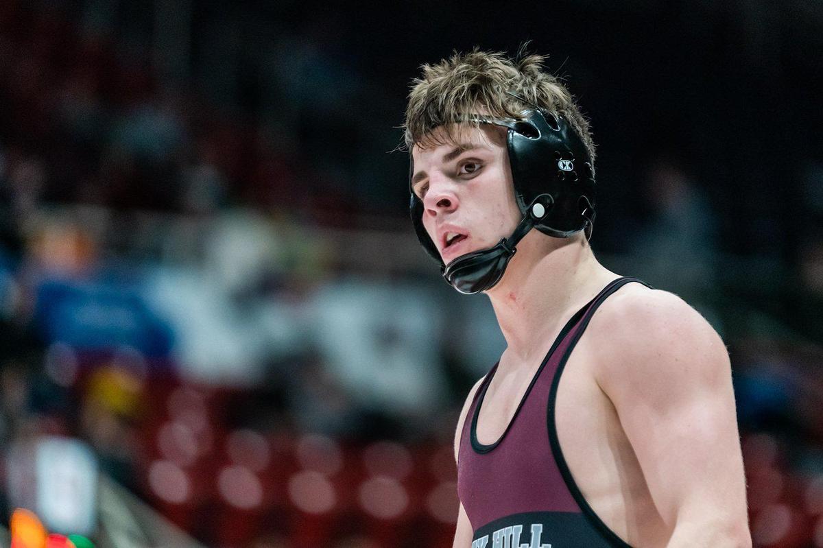 Rock Hill’s Bailey Wilkins (left) would fall short in the 138 pound championship match at the Holy Angels Tourament at Bojangles coliseum.