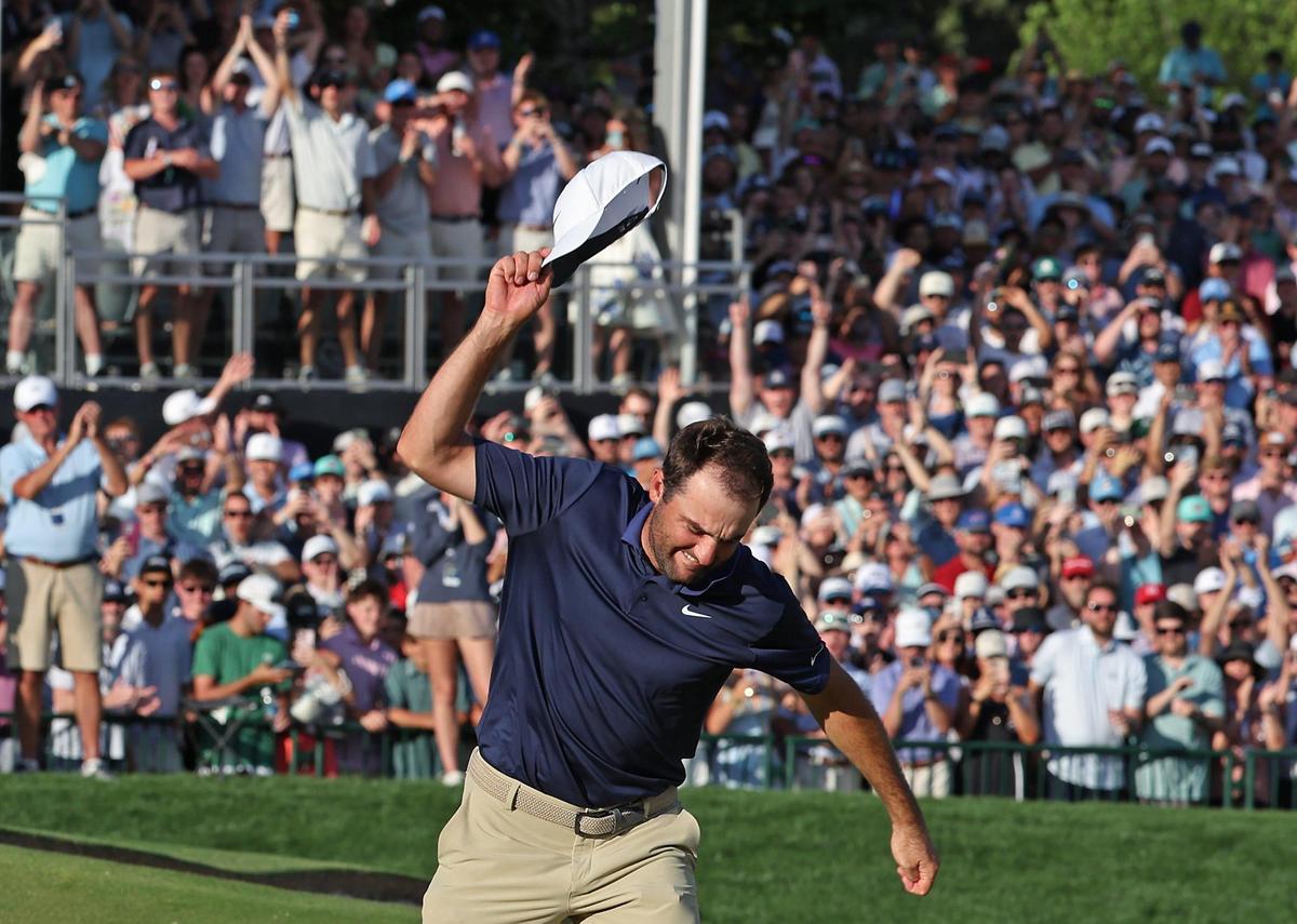 Scottie Scheffler spikes his hat on the 18th green after sinking the final putt to win the PGA Championship at Quail Hollow Club in Charlotte, NC on Sunday, May 18, 2025. Scheffler shot -11 for the tournament.