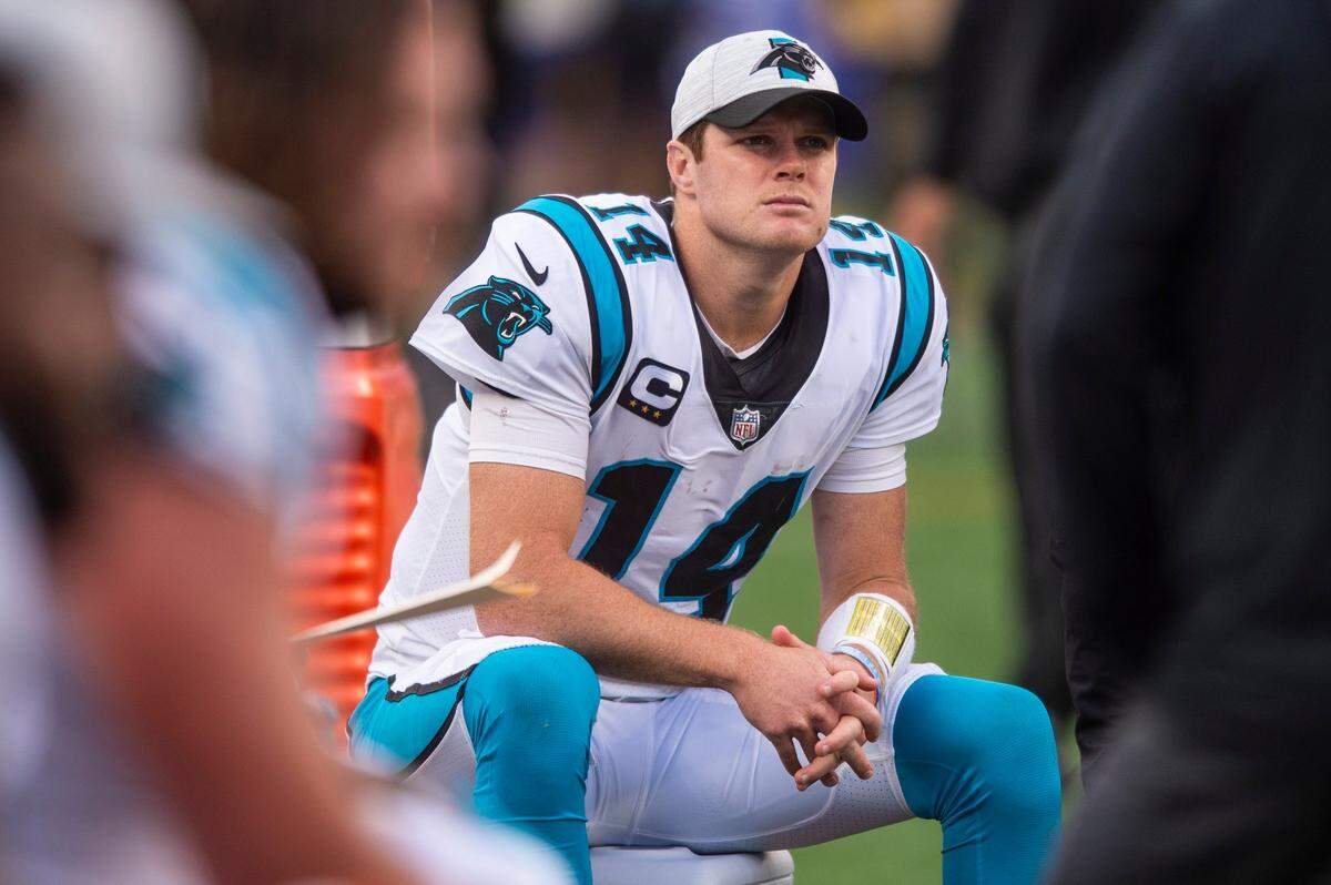 Panthers quarterback Sam Darnold sits on a cooler in the fourth quarter of Carolina’s 25-3 loss to the New York Giants. Darnold was benched during the game but will start again for the Panthers Sunday against Atlanta.