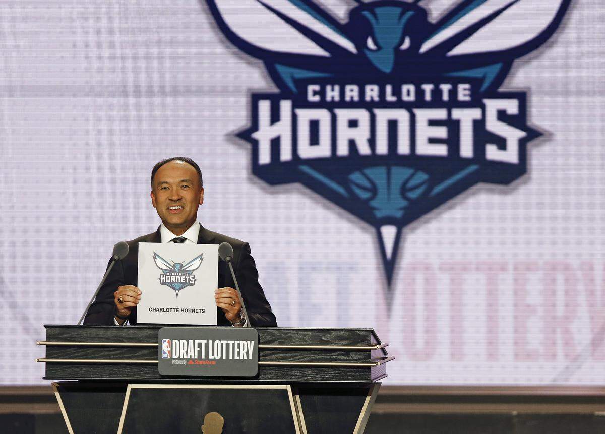 NBA Deputy Commissioner Mark Tatum announces that the Charlotte Hornets had won the 12th pick during the NBA draft lottery Tuesday in Chicago.